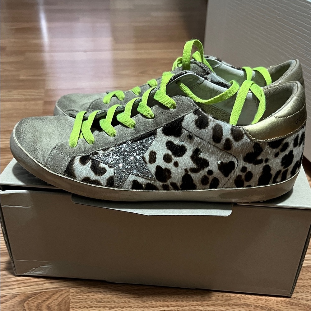 Stylish Leopard Print Golden Goose Sneakers with Neon Accents.
